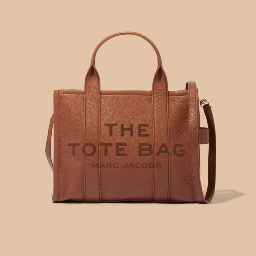 Marc Jacobs small leather tote bag with strap and duster bag.